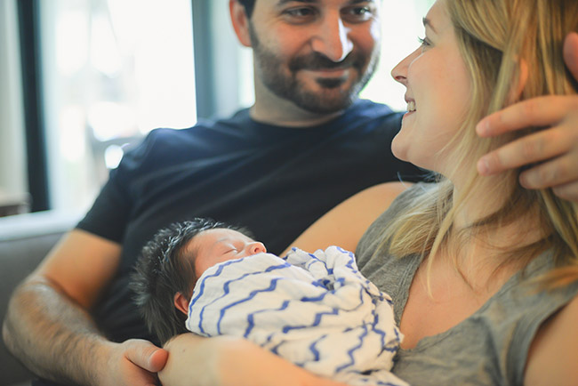 Image of a mother and father and their baby