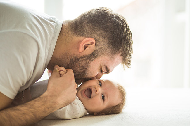 Image of a dad with his baby
