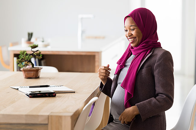 Woman planning for delivery at a des
