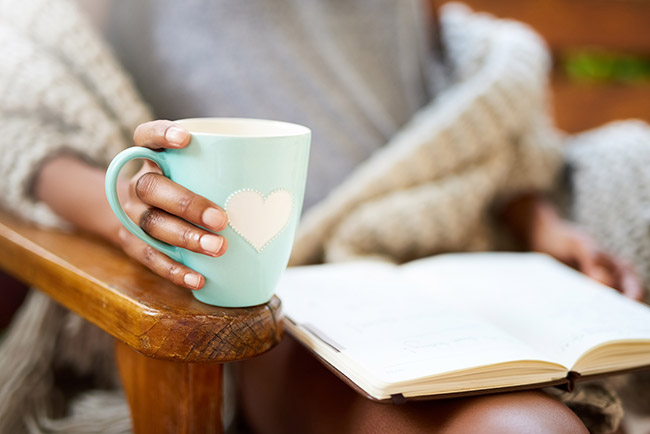 Mom with a mug and a book