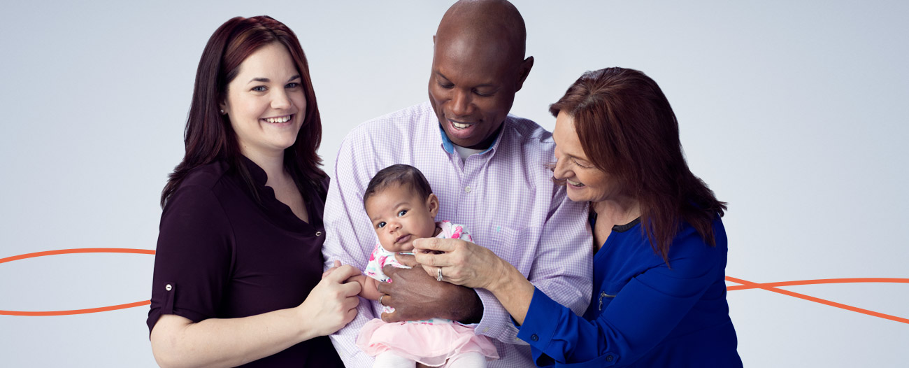 Image of a grandmother, father, mother and a baby