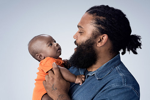 Dad holding baby
