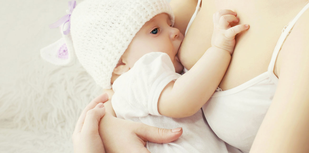 Image of a baby breastfeeding