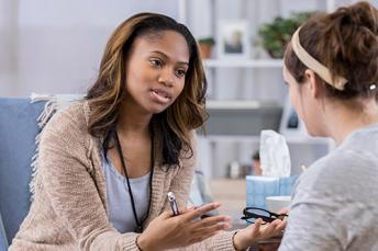 Counselor speaking with a mother